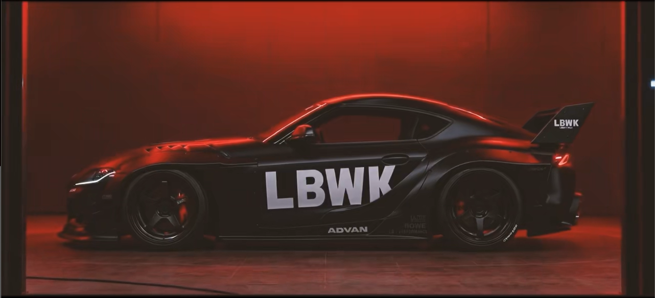 Red-lit side profile highlighting mechanical detail